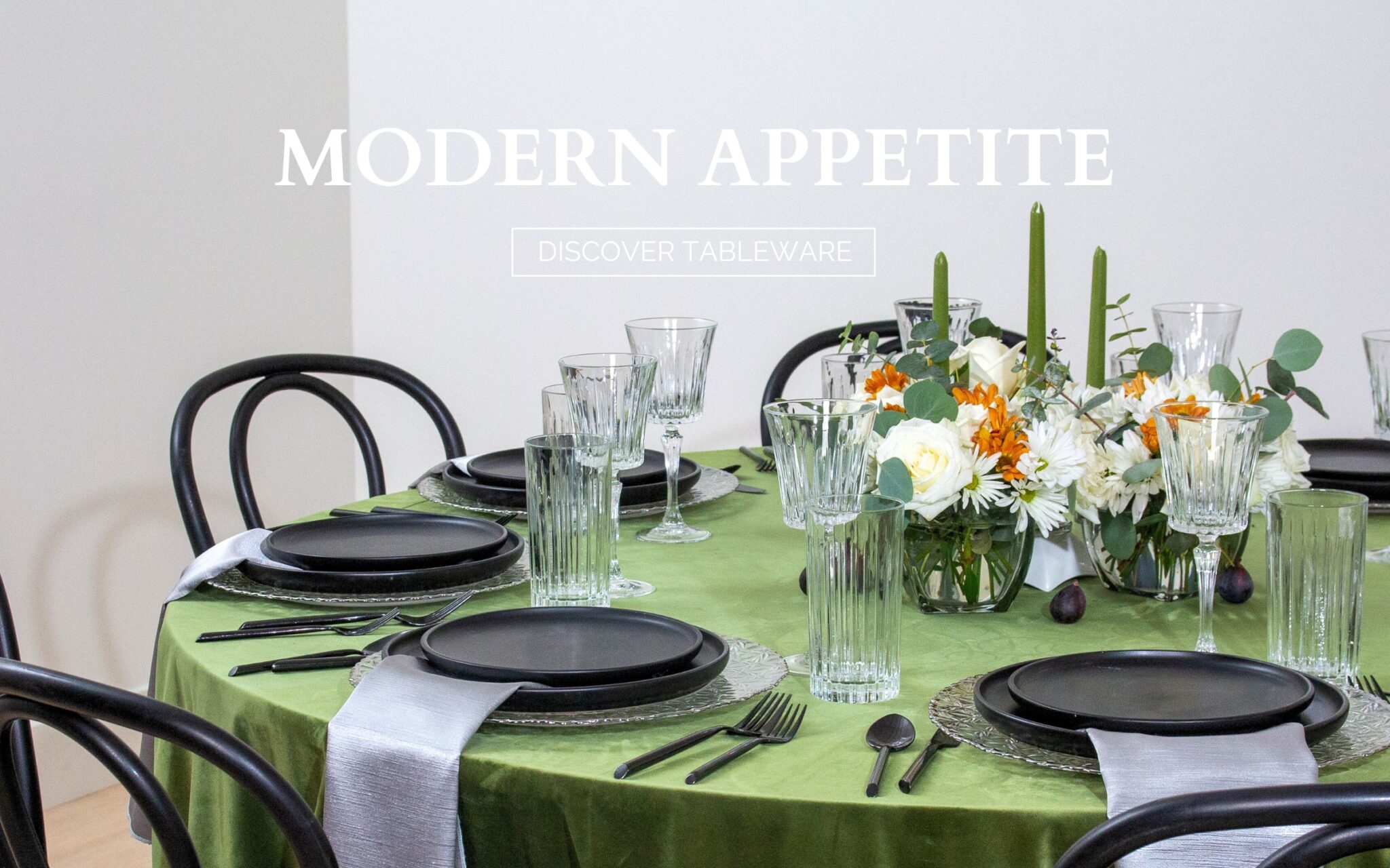 Table setting display with green linen