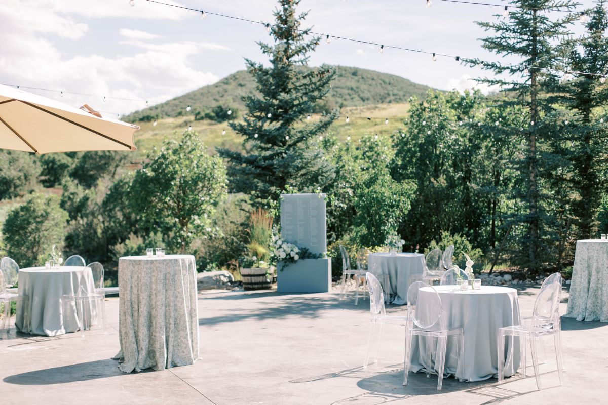 Outdoor tables and seating for indoor wedding