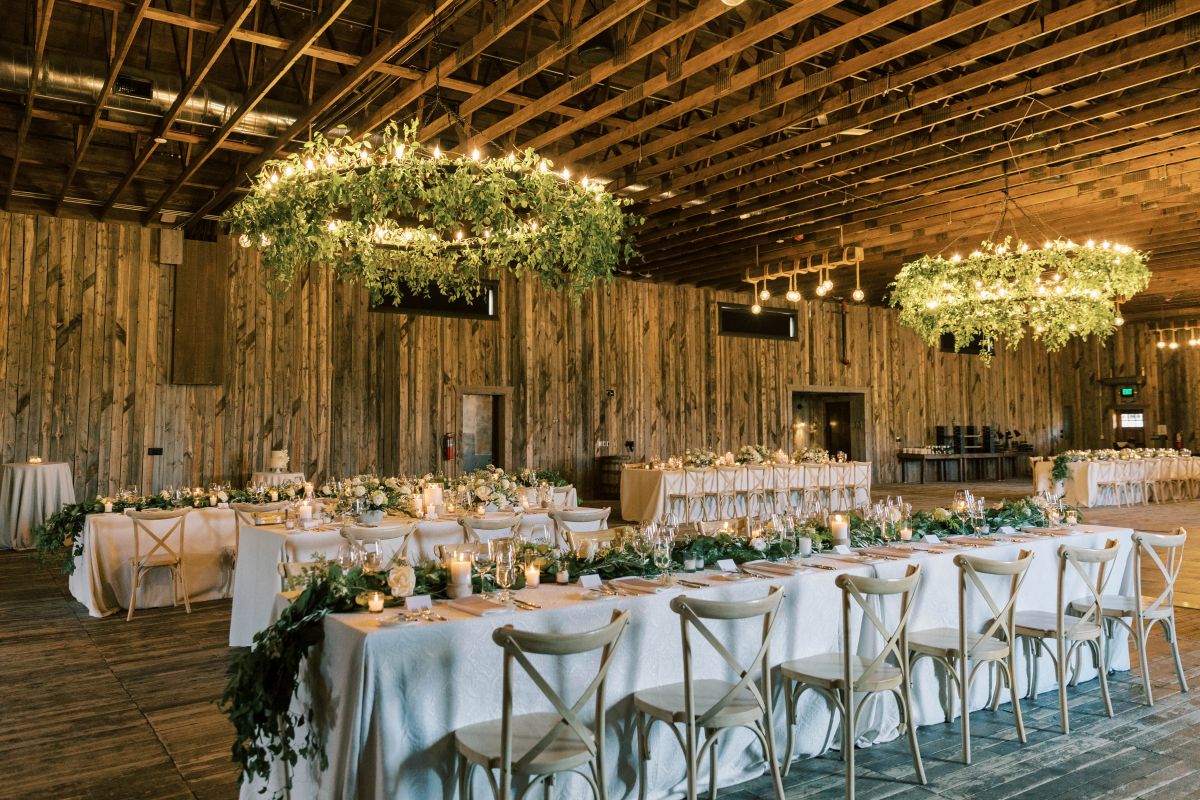 Table arrangement for indoor wedding with floral lighting