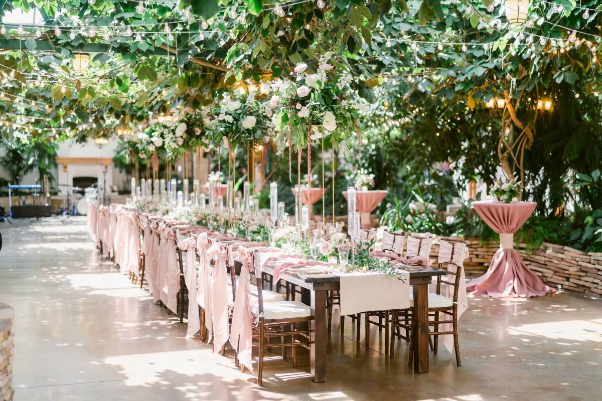 Complete view of wedding table setup with pink linens