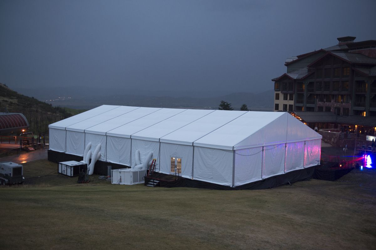 Insulated and enclosed event tent in a foggy mountain