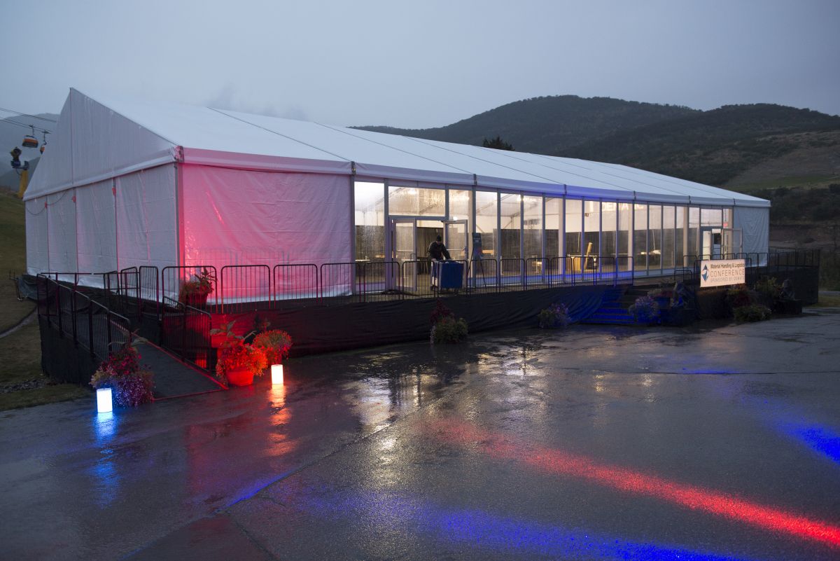 Front view of enclosed tent with windows, doors and an entrance ramp