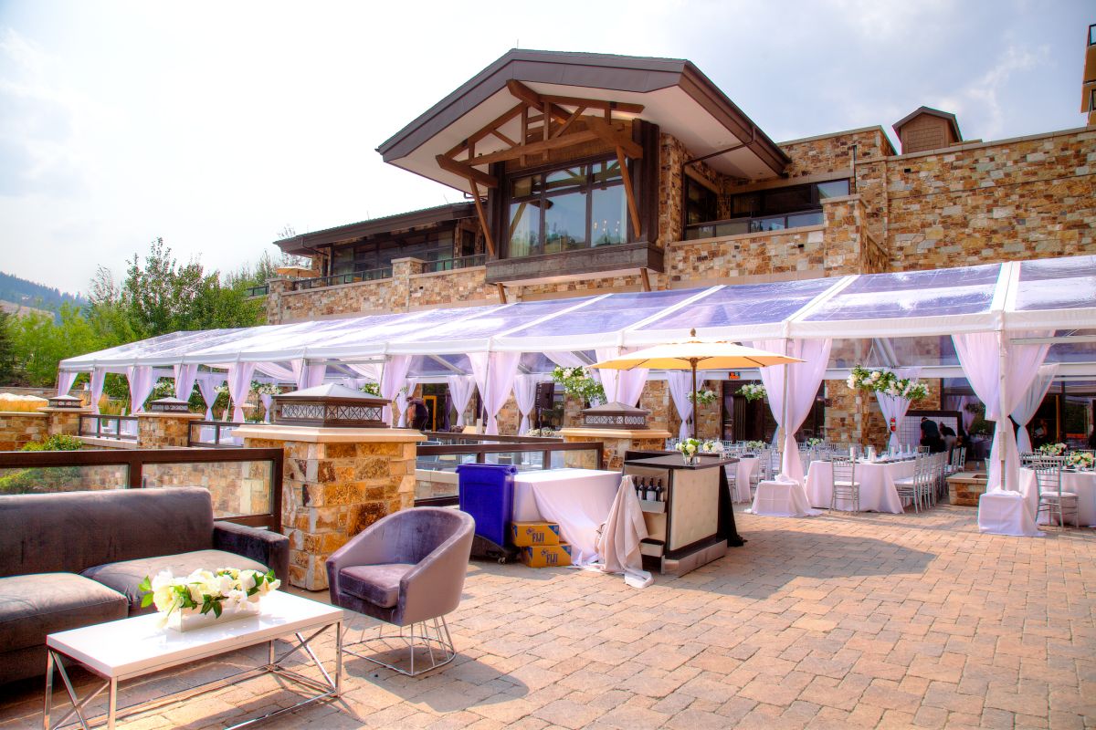 View of the outdoor wedding tent with additional Diamond Event rental products