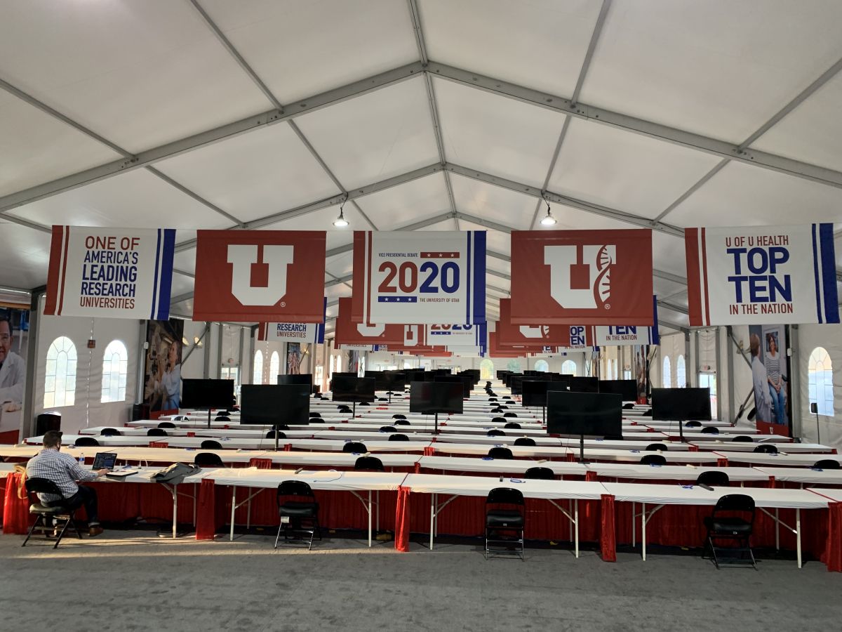 Inside view of the desks and monitors for the VP debate held within an enclosed tent