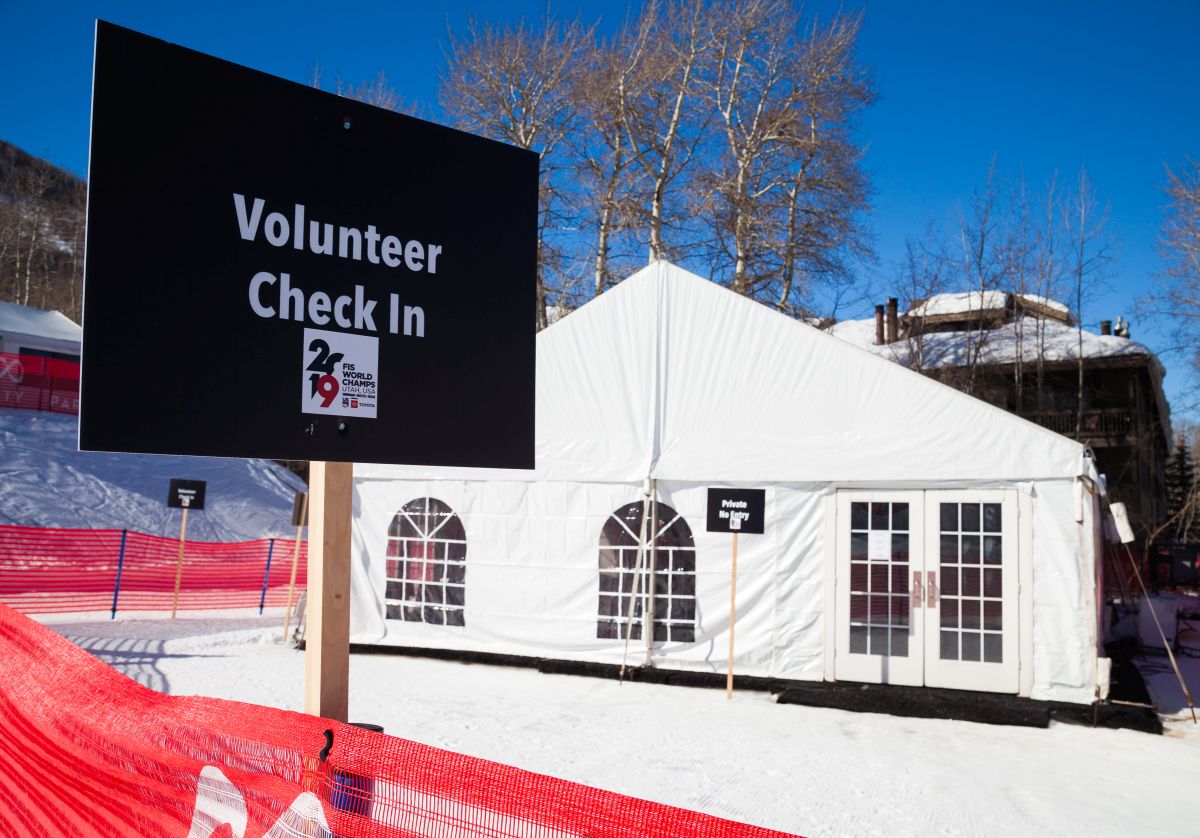 Enclosed tent for volunteer check in