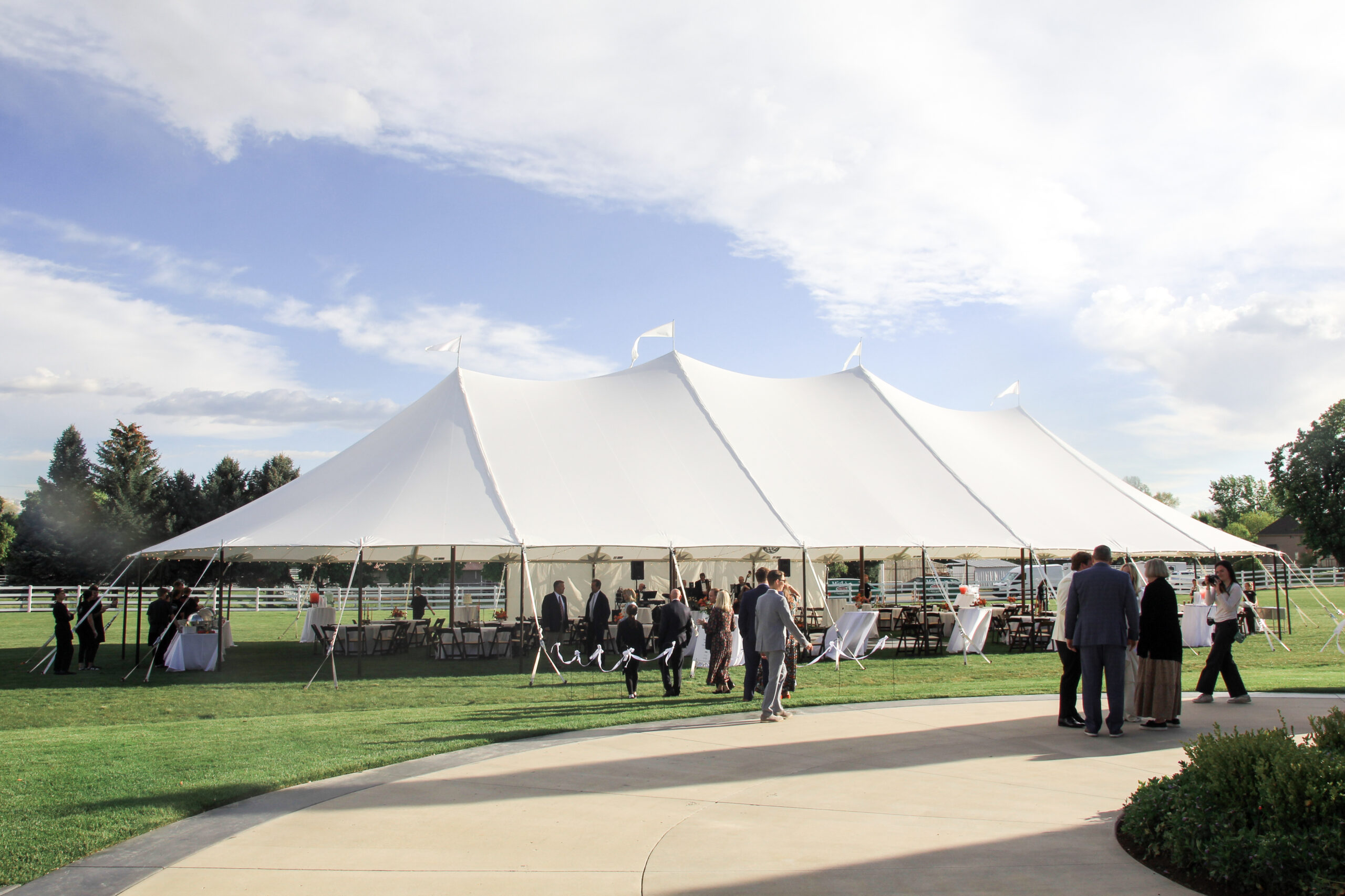 Sailcloth pole tent for summer backyard wedding