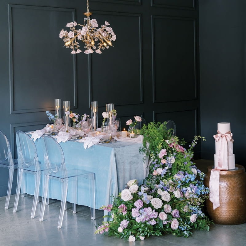 blue velvet table with floral arrangement
